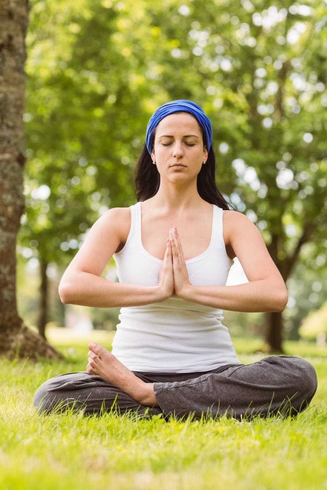 Woman meditating peacefully outdoors during recovery